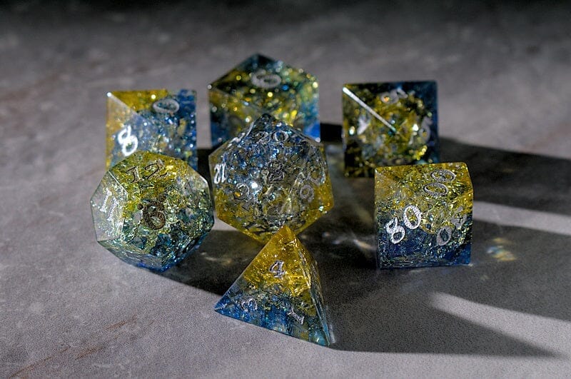 yellow and blue glass dice