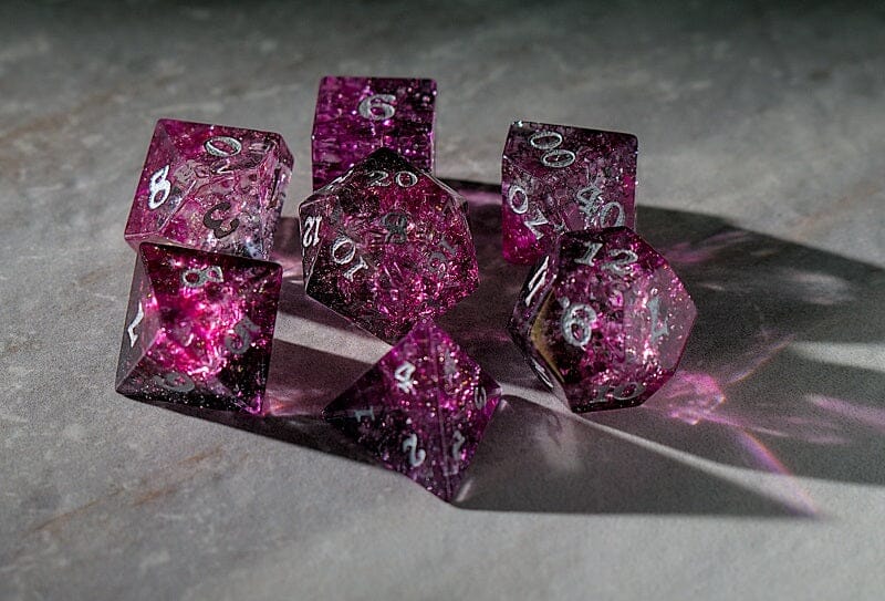 pink and black glass dice set